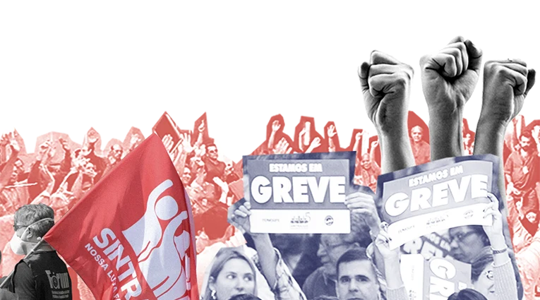 Integrantes da categoria em mobilização, com bandeira do Sintrajud e cartazes "Estamos em Greve"